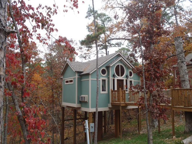 blue luxury treehouse cabin at The Grand Treehouse Resort in Eureka Springs, AR
