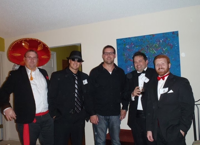 group of men posing in murder mystery party costumes at a fiesta murder mystery party