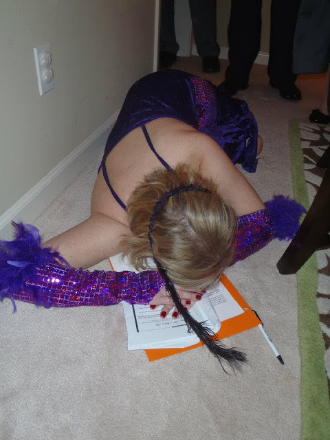 woman in flapper costume lying on floor at 1920s murder mystery party