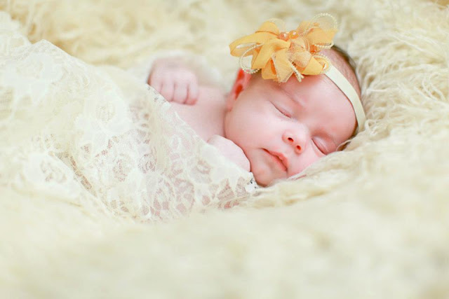 newborn photos of a one-week-old baby girl - The Gifted Gabber