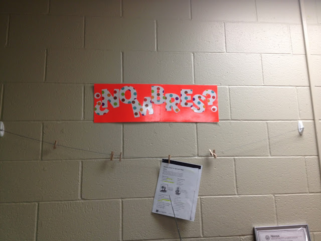 a no name papers display on a classroom wall