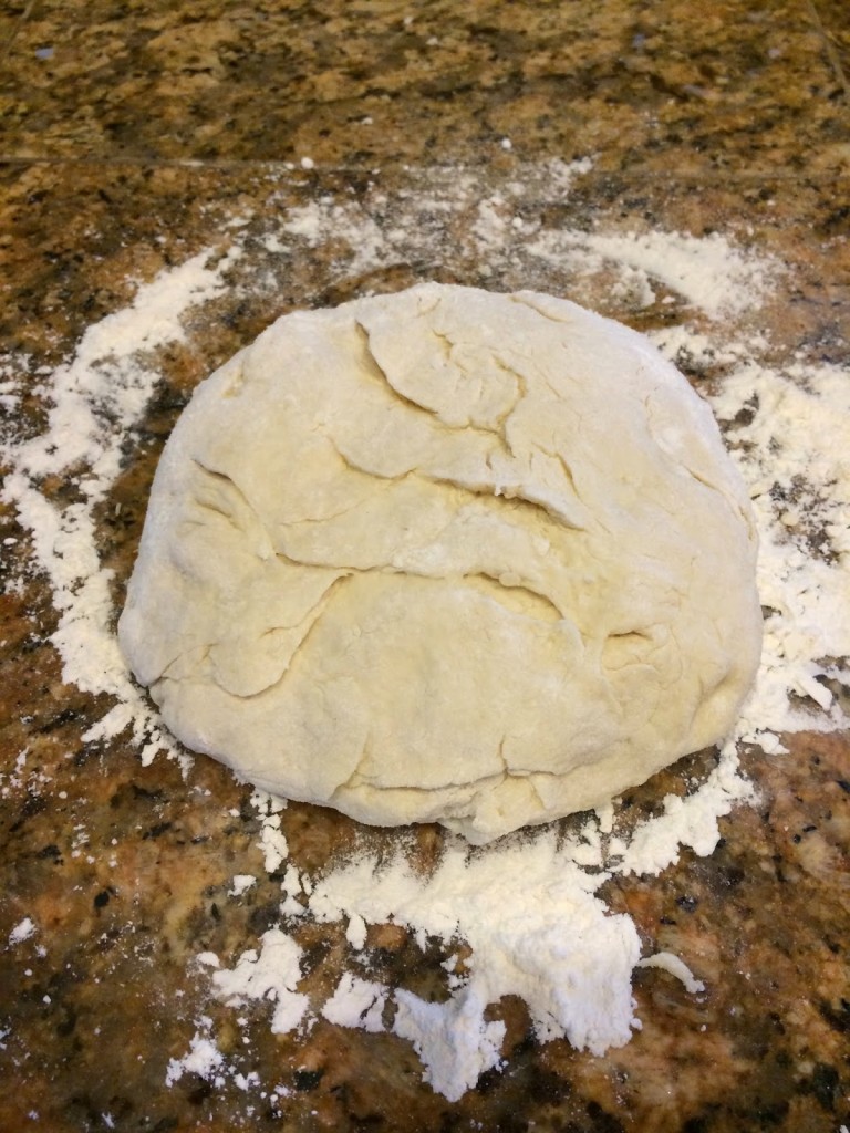 ball of dough for Indian fry bread on counter with flour 