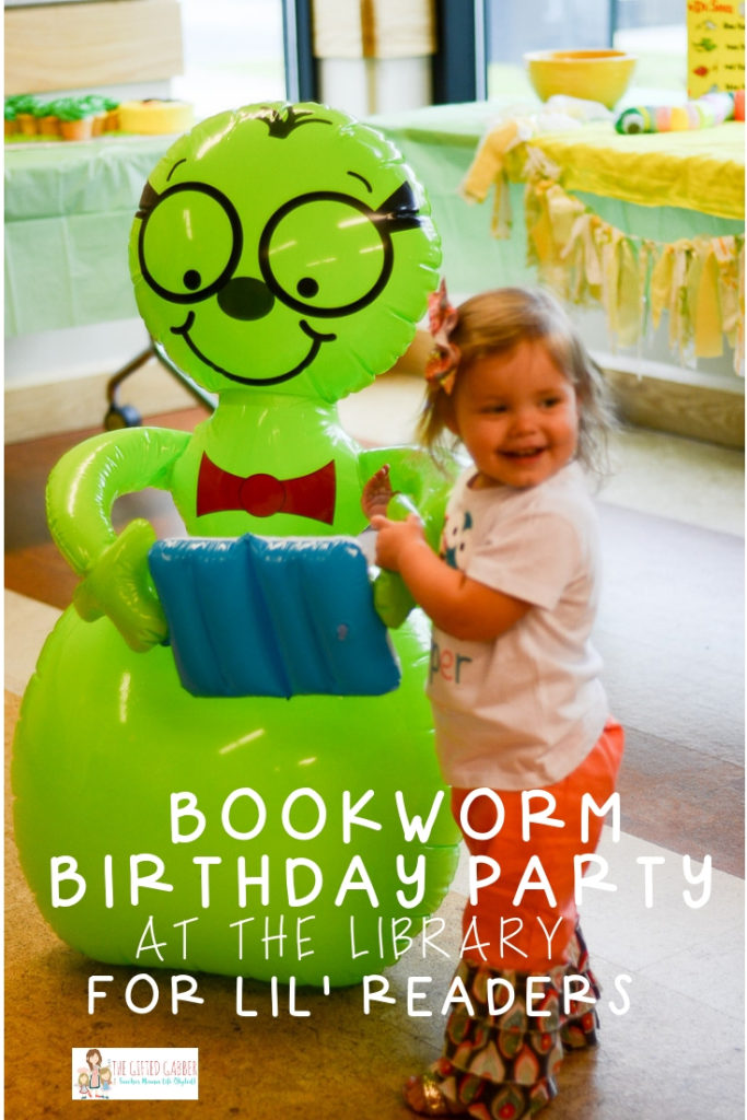 little girl stands with large inflatable green bookworm at a library party with text overlay 