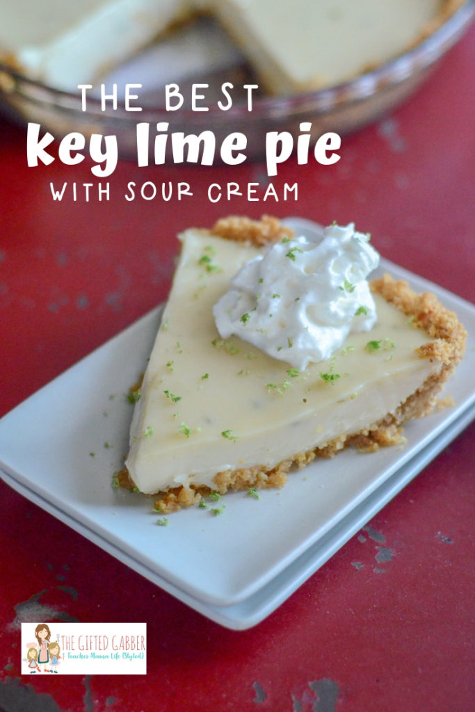 Florida key lime pie slice on white plate on red background 