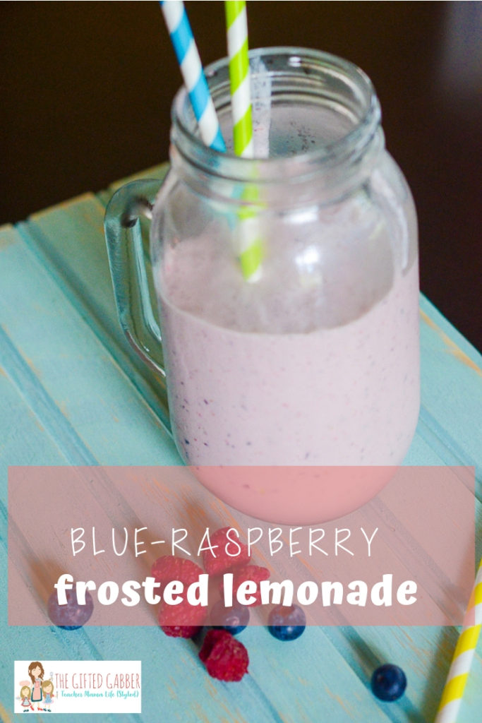 blue raspberry frozen lemonade in glass mug with straws