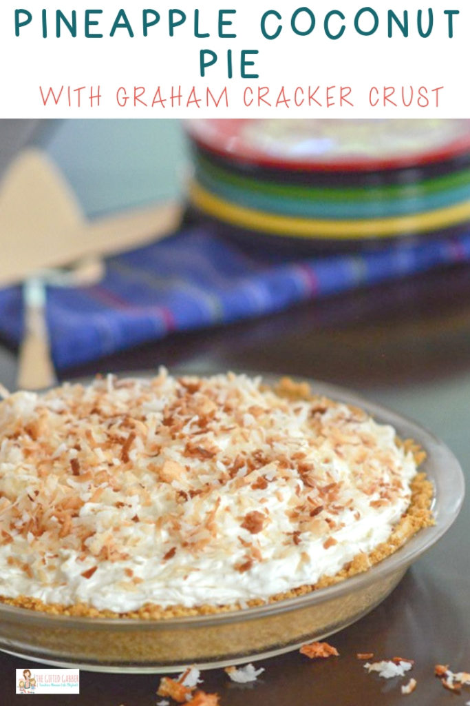 a tropical coconut pineapple cream cheese pie in a glass pie plate with serving pieces in back