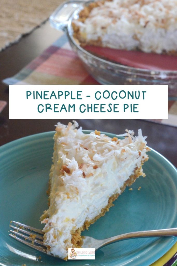 piece of pineapple cream cheese pie on teal plate with pie plate in back