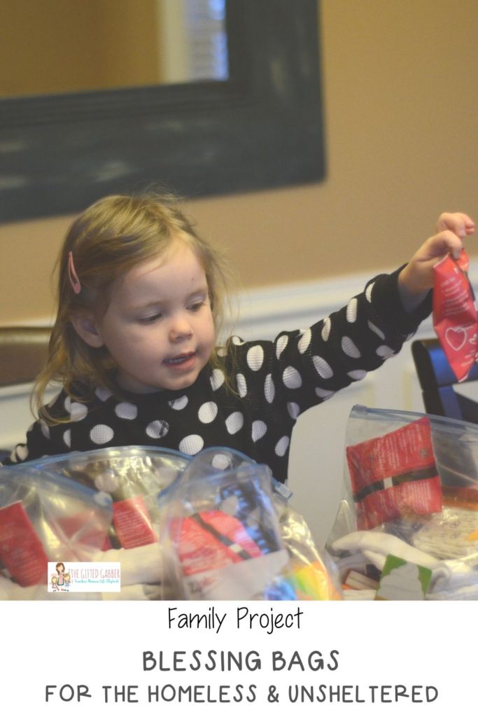 little girl stocks blessings bags with hygiene supplies for homeless residents