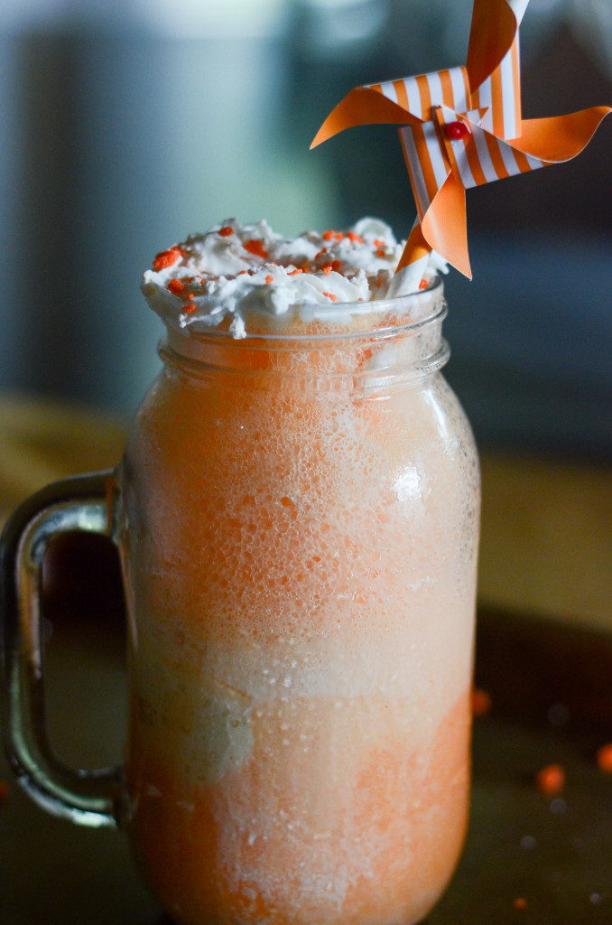 frozen orange creamsicle drink in frosty mug with pinwheel 