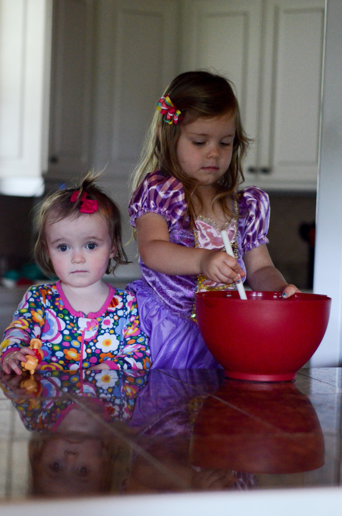 two small children help in the kitchen 