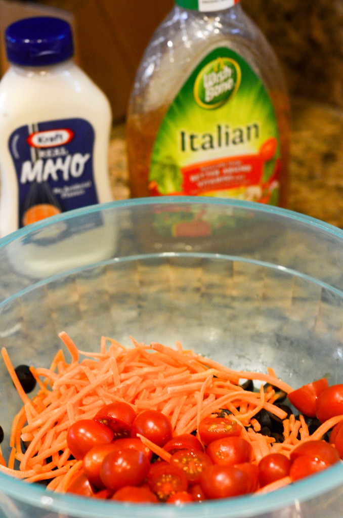 carrots and tomatoes in a blue bowl