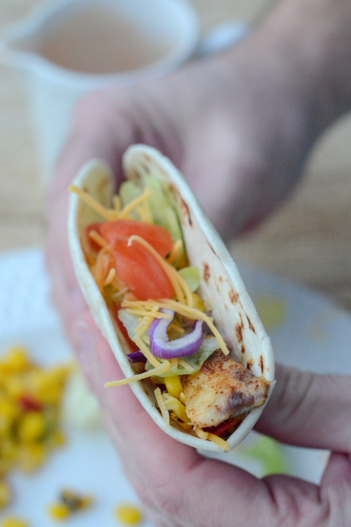 This easy fish taco recipe with blackened tilapia combines sauteed tilapia with honey roasted sweet corn, a coleslaw or lettuce blend of your choice, and a salsa ranch sauce. The flavor medley is just the best! This recipe could be modified for grilled or fried tilapia, but the sauteed tilapia is so easy, and these tacos are ready in a flash!
