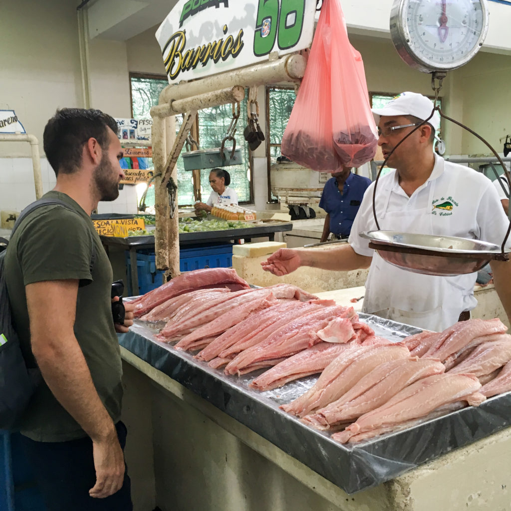 man visits Panama City fish market 