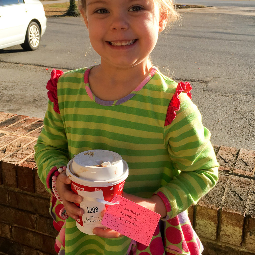 little girl takes her teacher a "Warmest Thanks" gift as part of a coffee gift idea 