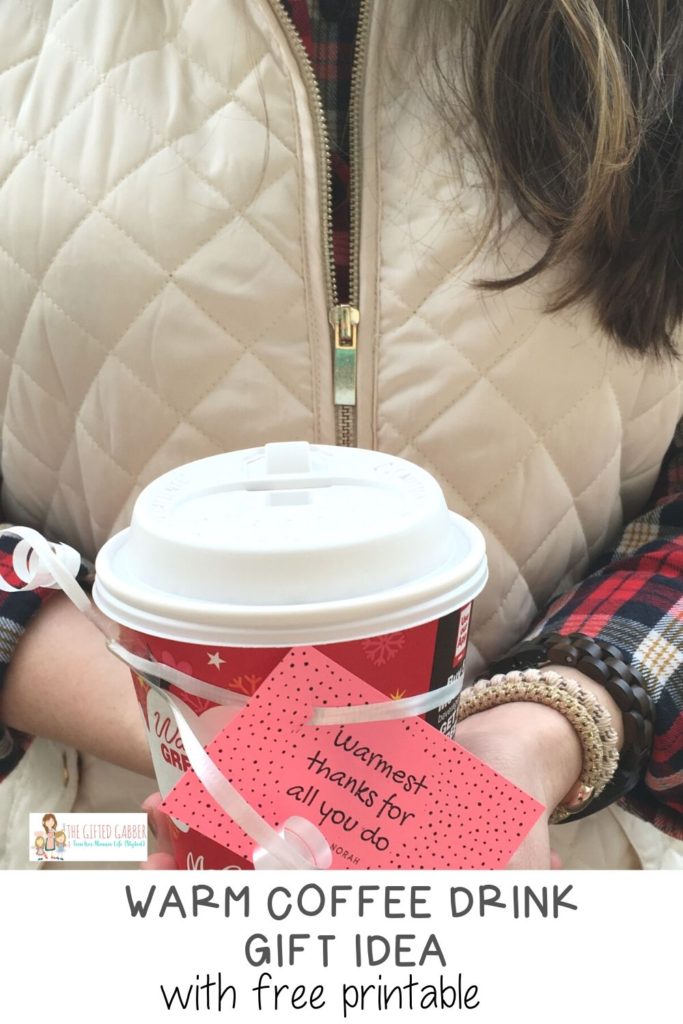 woman holds coffee gift for coffee lovers in hands with a free printable thank you tag