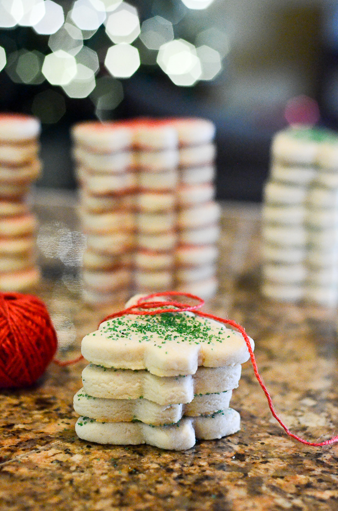 Christmas tree sugar cookies in stacks on counter
