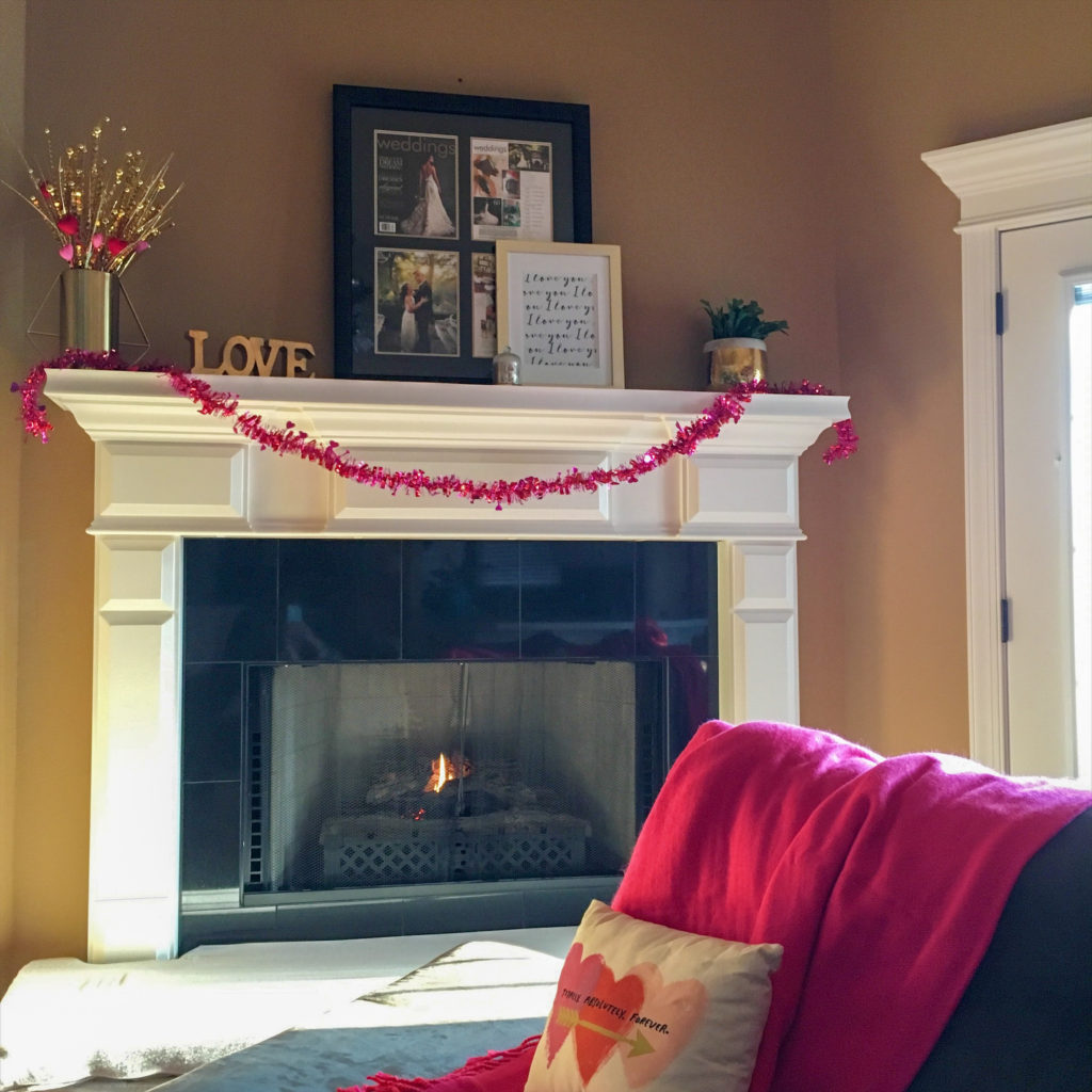 couch with mantle decorated for Valentine's day