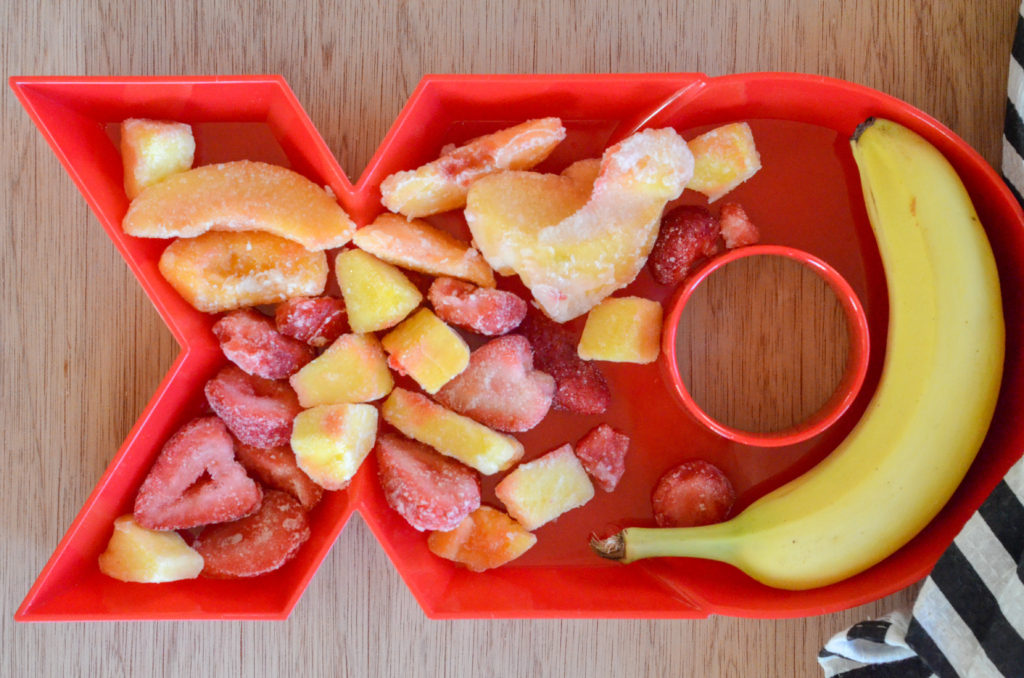 frozen fruit and a banana in an XO platter for a dairy free smoothie recipe