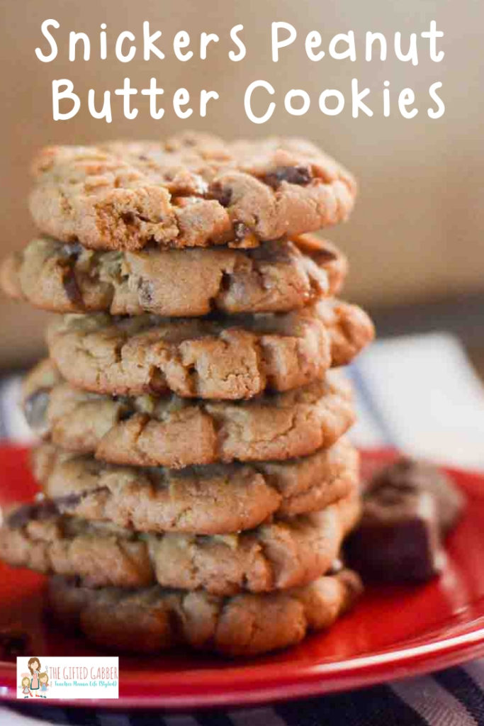 stack of peanut butter cookies on red plate