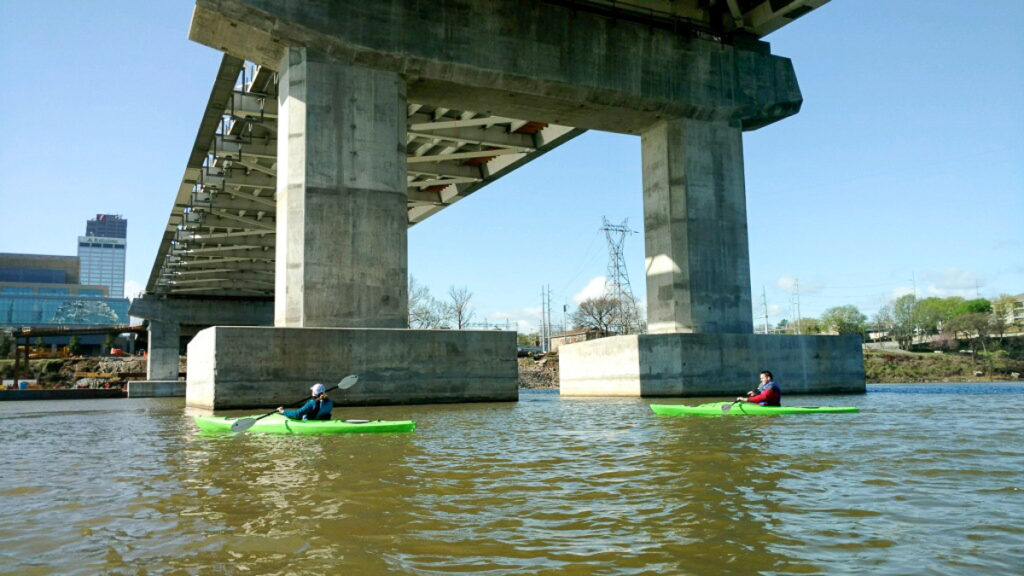 two people kayak the Arkansas River in Little Rock, Arkansas on a kayak tour 