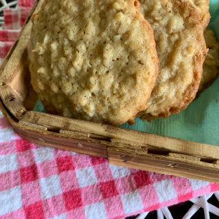 Cinnamon Toast Crunch cookies with oatmeal in a small shallow basket over colorful napkins