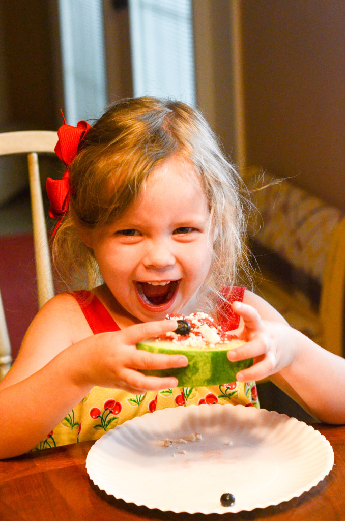 little girl eating watermelon pizza 