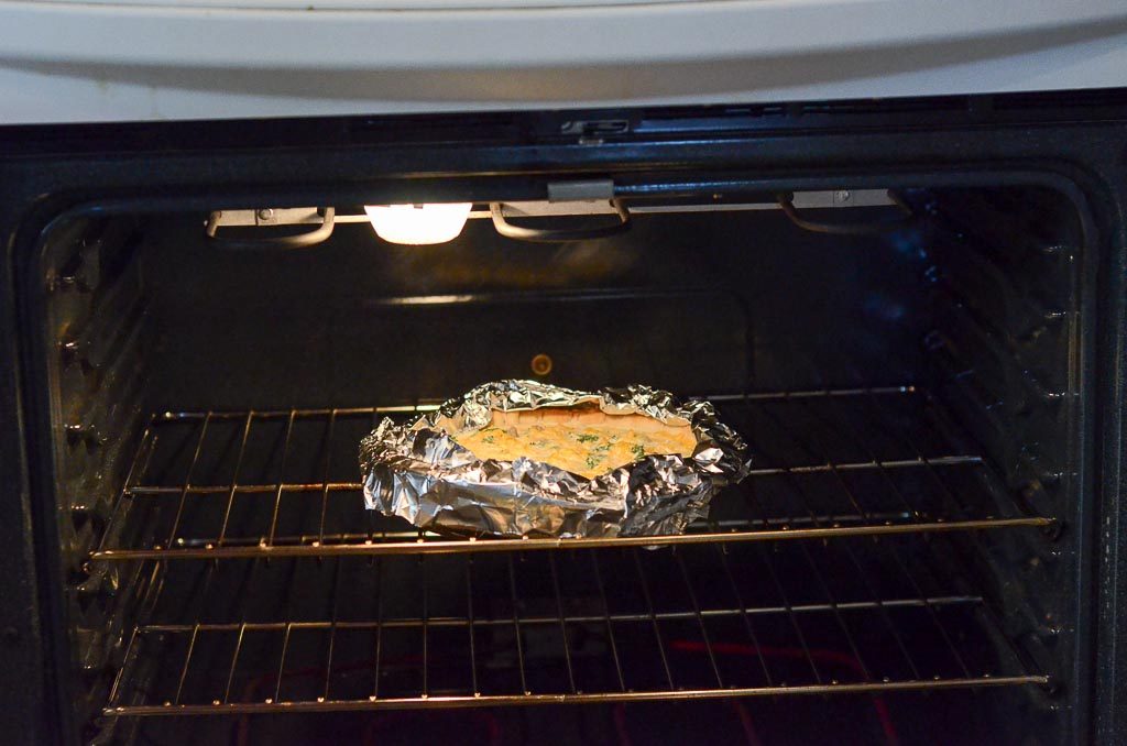 pan wrapped in foil in oven with foil on top