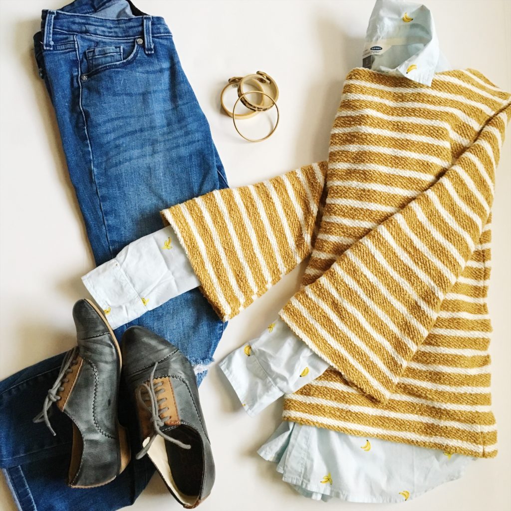 striped sweater with banana blouse, blue jeans and lace-up shoes