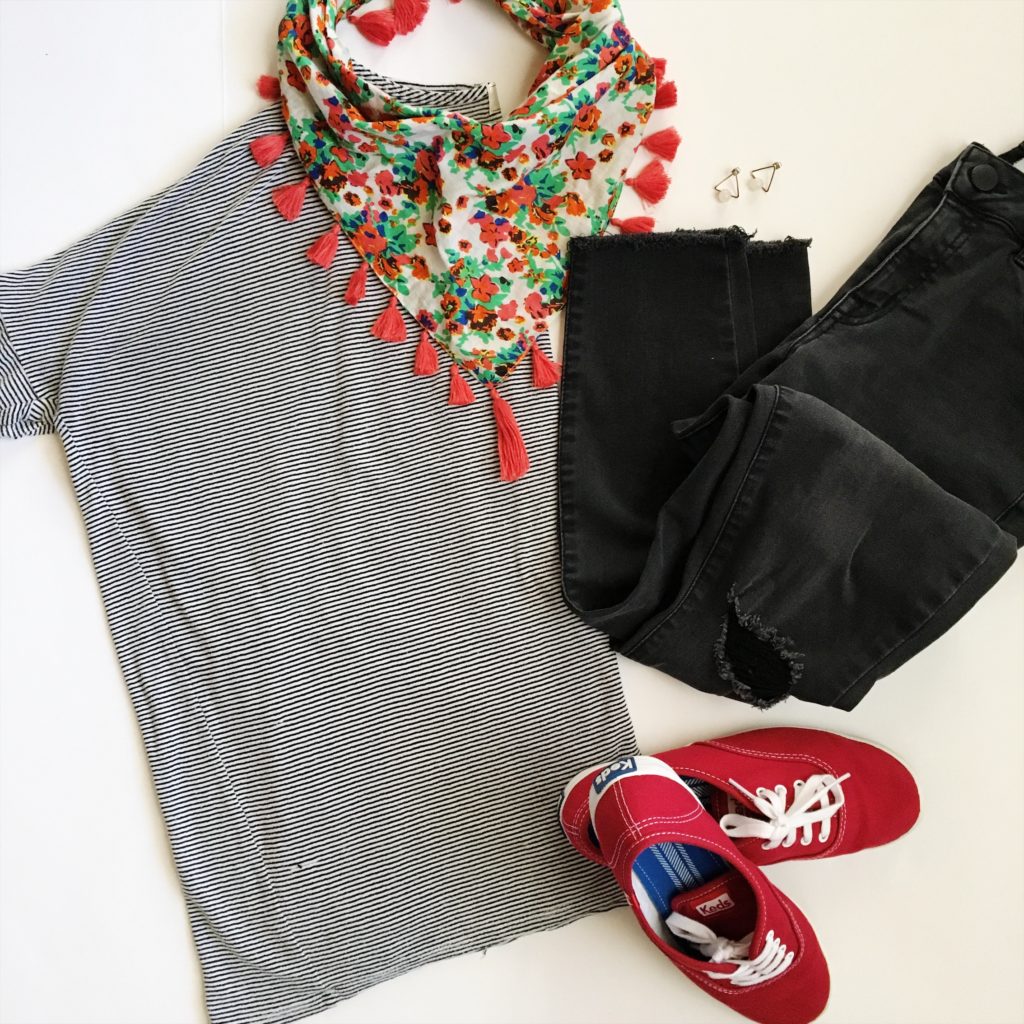 flay lay image with striped tunic, floral scarf, black jeans and red Keds outfit 