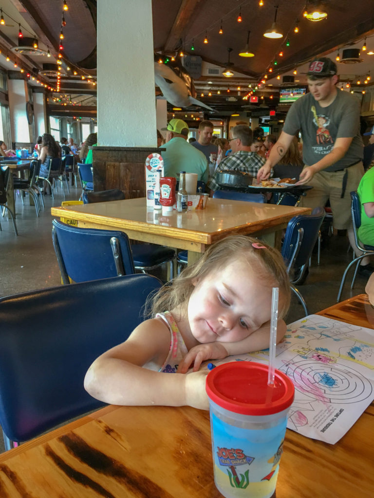 little girl coloring at Joe's Crab Shack Branson