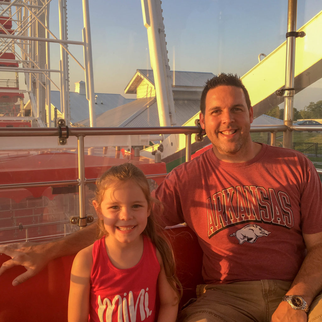father and daughter ride on the Branson Strip ferris wheel 