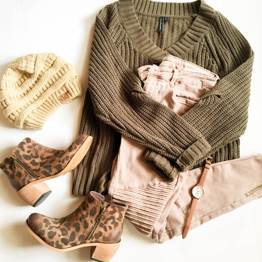 leather leopard booties with knit hat, olive sweater and tan moto jeans in flay lay 