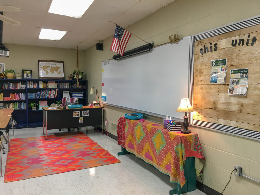 school room filled with boho rainbow classroom decor like tribal rug and kantha quiltin an overall boho classroom theme