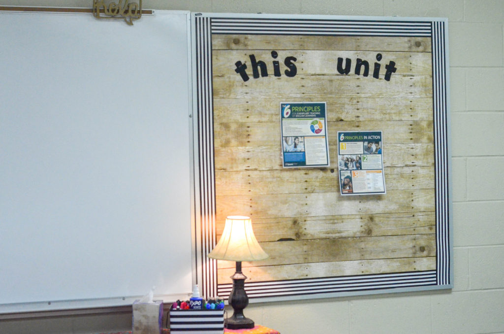 school bulletin board with striped bulletin board trim and a "this unit" wording 