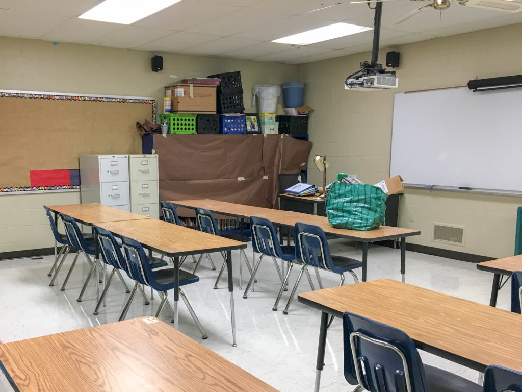 old classroom during summer classroom cleaning with everything packed in boxes