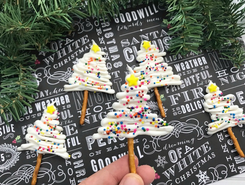 pretzel Christmas trees - Christmas snacks for kids on holiday background 