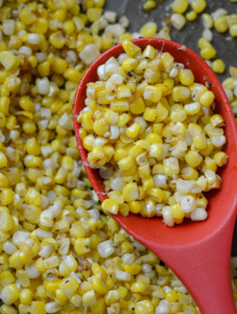 southern fried corn in a red spoon