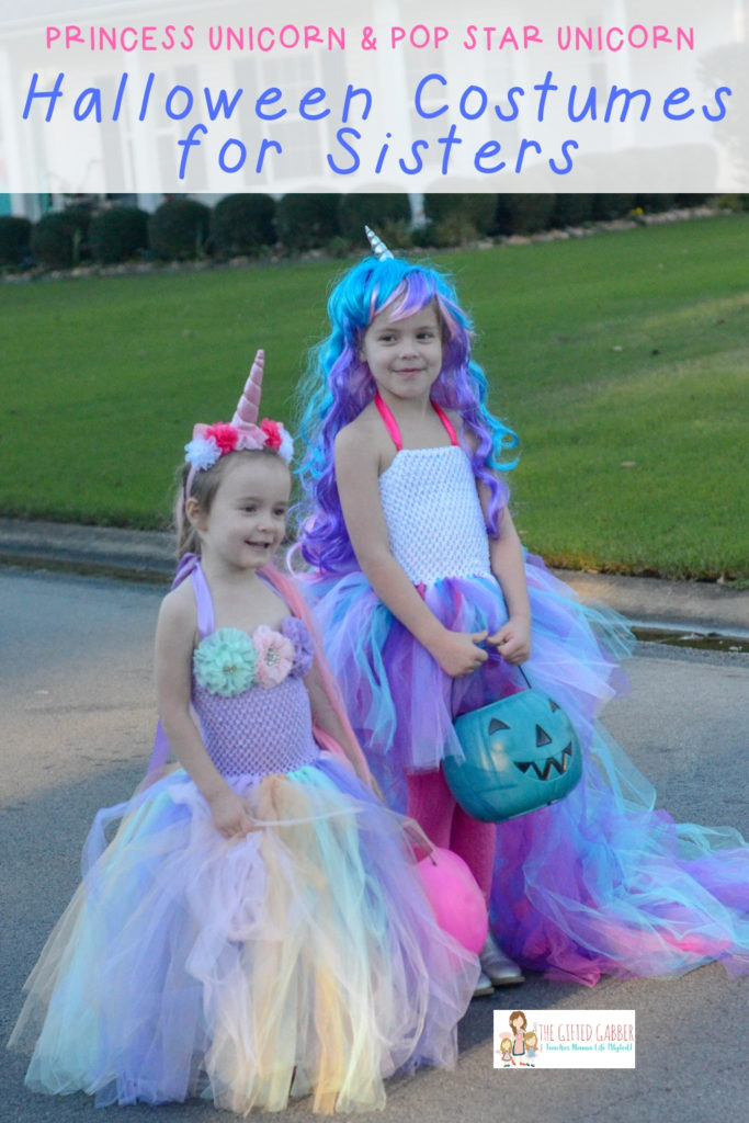two young sisters wearing Halloween costumes