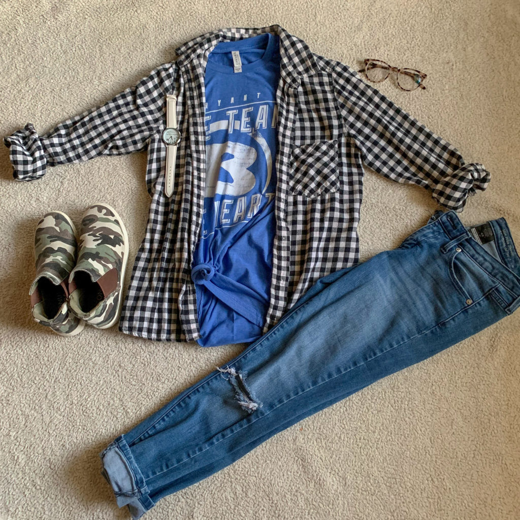 black-and-white plaid flannel over blue school shirt, jeans, and camo sneakers flat lay