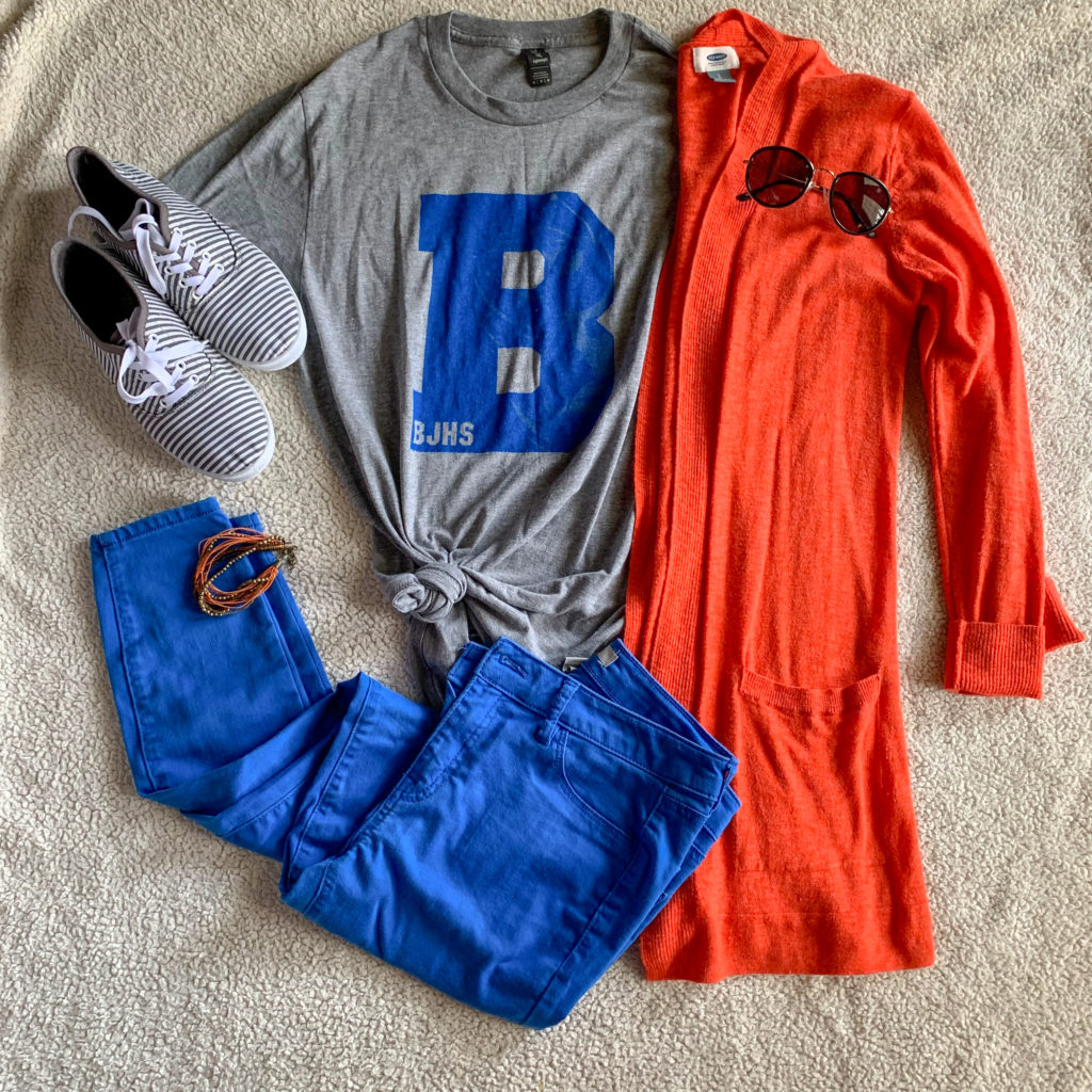 school spirit wear outfit with gray teacher t-shirt, orange cardigan, blue pants, and striped tennis