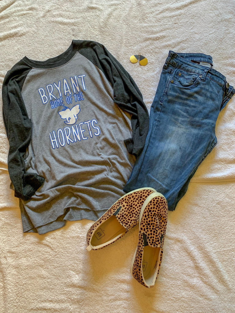 long sleeve school spirit shirt with jeans and cheetah print sneakers