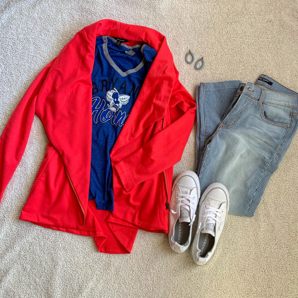blue school spirit shirt layered under red blazer with striped jeans and white Converse flat lay
