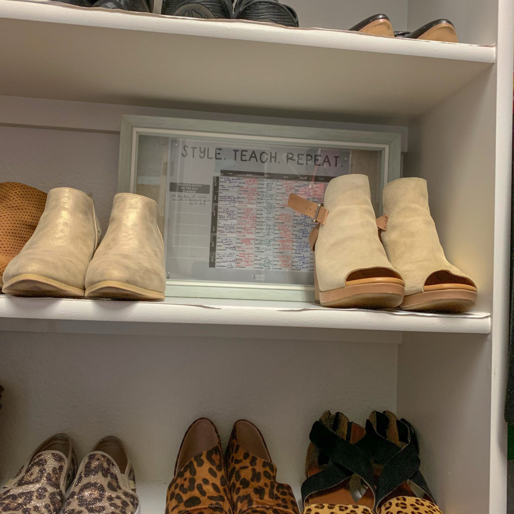 shoes lining shelf in closet with a wardrobe planner in a frame in background