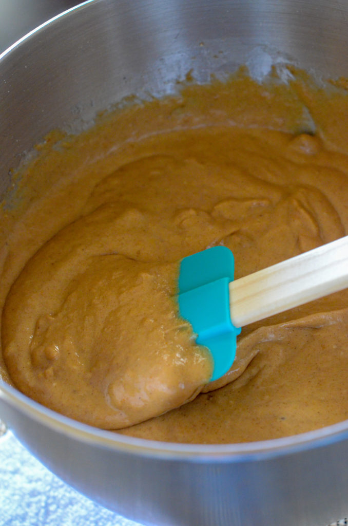 pumpkin cake mix batter in bowl with spatula