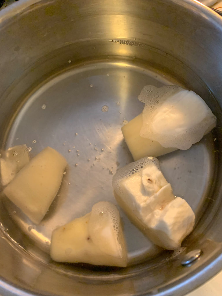 pieces of yuca in saucepan for boiled yuca