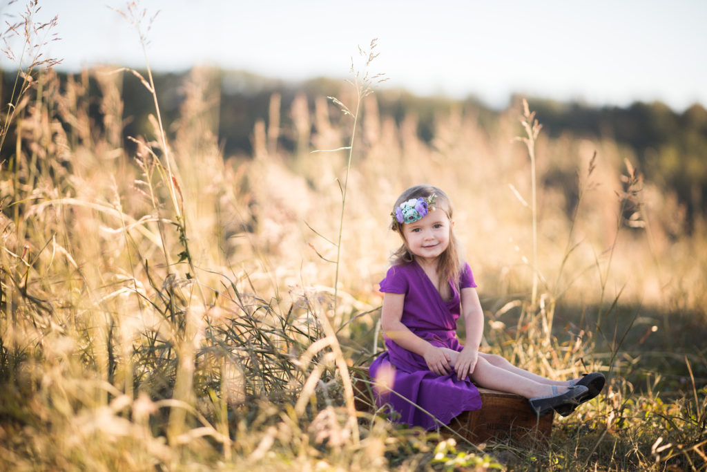little girl poses in purple boho maxi dress 