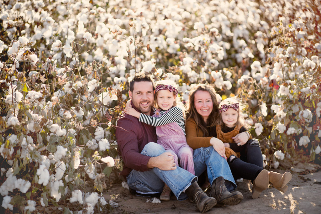 family poses in cotton field images