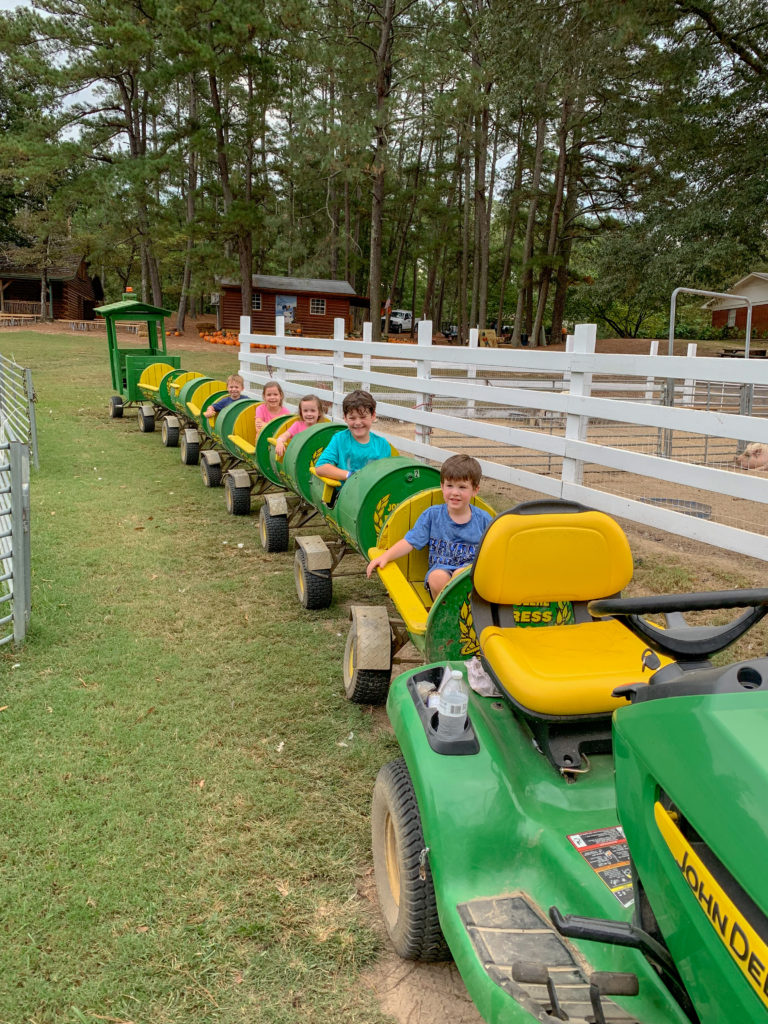 kids on tractor train ride at Family Farm in Arkansas