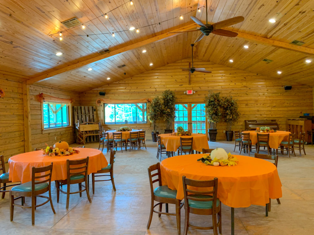 dining area inside the lodge at Family Farm with fall decor