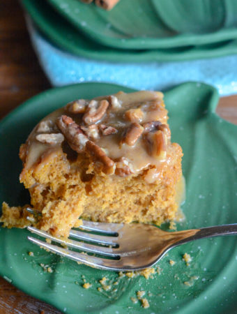 pumpkin poke cake on green pumpkin plate